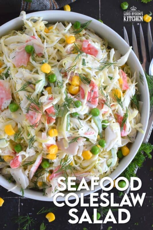 Chunks of crab and lobster are tossed with lots of fresh vegetables, like cabbage, cucumber, corn, peas, and green onions in a homemade creamy, tangy, and savoury dressing. Consider your budget and use real seafood or imitation crab and lobster to make this absolutely refreshing Seafood Coleslaw Salad! #seafood #salad #coleslaw #imitation #crab #lobster