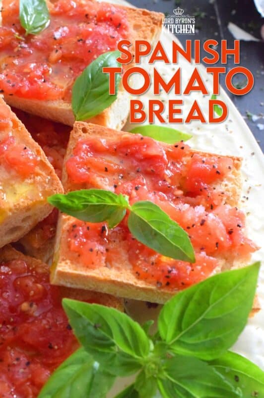 Summer fresh tomatoes are peeled and mashed and spread onto warm, toasted bread that has been rubbed with whole garlic cloves. Seasoned with ground black pepper and flaked sea salt, and a splash of olive oil, Spanish Tomato Bread is a popular tapas bar recipe! #catalan #spanish #tomato #bread