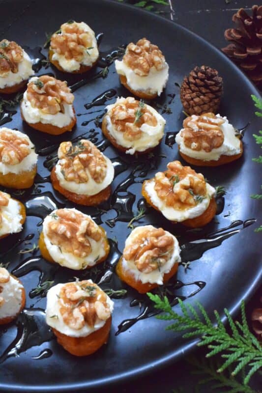 Don't be shy; this appetizer is meant to be eaten in one big bite! Dried Apricot and Walnut Appetizers have combinations of flavours and textures that just make everything all right. Topped with whipped cream cheese and drizzled with honey, these are simply delectable! #walnut #apricot #christmas #holiday #nobake #appetizer