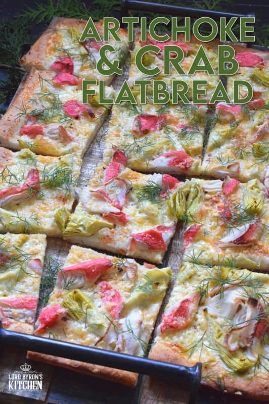 Cheesy, garlicky, and spicy are three words one could use to describe this Artichoke and Crab Flatbread.  Easy to prepare, but authentically delicious, this appetizer will be talked about long after the holidays are over, which is why this recipe makes two! #appetizer #seafood #crab #holiday #christmas #flatbread