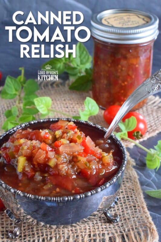 Spoon this Canned Tomato Relish onto hamburgers, hotdogs, sausages, and sandwiches too. Prepared with cucumbers, bell peppers, zucchini, onion, and tomatoes, this relish is the best way to preserve all of that homegrown late-summer harvest! #hamburger #tomato #relish #canning #preserves #tomatoes