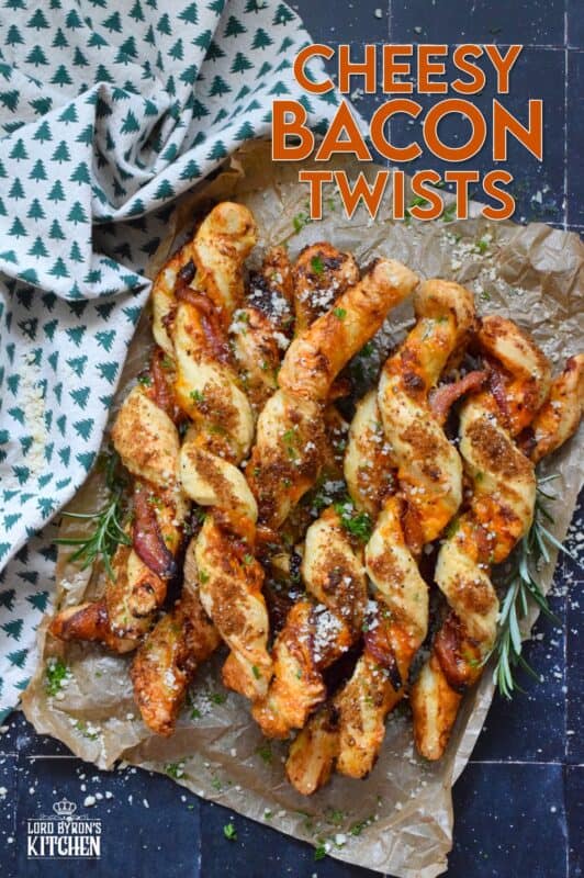 This appetizer consists of salty bacon twisted around light and airy, buttery puff pastry with shredded cheddar cheese all in brown sugar, thyme, oregano, garlic, onion, and ground black pepper seasoning! Words do not exist to describe how wonderfully delicious these are! #bacon #puffpastry #cheesy #appetizer