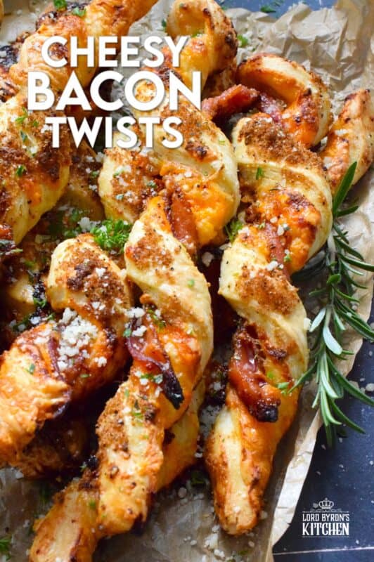 This appetizer consists of salty bacon twisted around light and airy, buttery puff pastry with shredded cheddar cheese all in brown sugar, thyme, oregano, garlic, onion, and ground black pepper seasoning! Words do not exist to describe how wonderfully delicious these are! #bacon #puffpastry #cheesy #appetizer