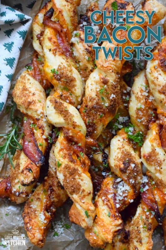 This appetizer consists of salty bacon twisted around light and airy, buttery puff pastry with shredded cheddar cheese all in brown sugar, thyme, oregano, garlic, onion, and ground black pepper seasoning! Words do not exist to describe how wonderfully delicious these are! #bacon #puffpastry #cheesy #appetizer