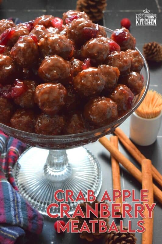 Serve these Crab Apple Cranberry Meatballs as a holiday appetizer and watch just how quickly they disappear! Store-bought frozen meatballs are paired with frozen cranberries, apple juice, and a jar of jelly to make a very delicious and festive party favourite! #crabapple #meatballs #holiday #appetizers