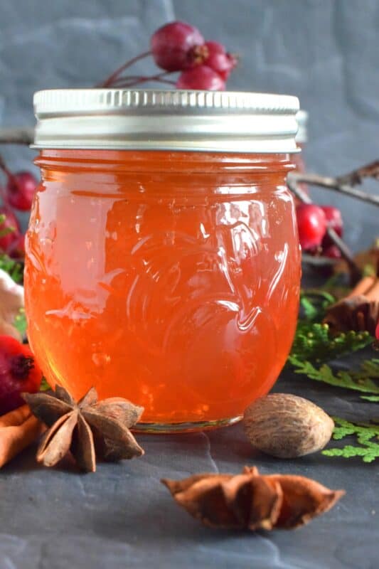 Easily transform those overly tart backyard crab apples into the most delicious Spiced Crab Apple Jelly! All you need are crab apples, water, sugar, and a few spices! This jelly is sweet and tart and has a strong crab apple flavour.  With the addition of cinnamon, nutmeg, allspice, and ginger, the taste is warming and comforting too. #crabapple #apple #jelly