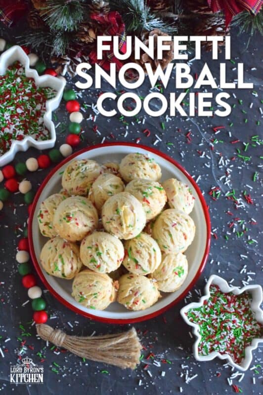 A holiday cookie platter must always have a cookie that is packed with sprinkles and these Funfetti Snowball Cookies fit the bill quite nicely! These are puffy, rounded cookies that require only a few of the most basic pantry ingredients, yet they look and taste amazing! #funfetti #christmas #cookies #sprinkles
