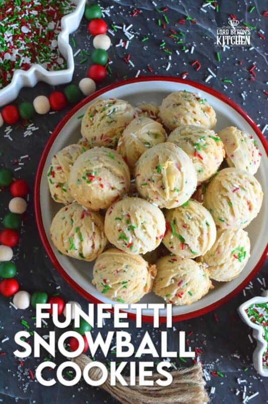 A holiday cookie platter must always have a cookie that is packed with sprinkles and these Funfetti Snowball Cookies fit the bill quite nicely! These are puffy, rounded cookies that require only a few of the most basic pantry ingredients, yet they look and taste amazing! #funfetti #christmas #cookies #sprinkles