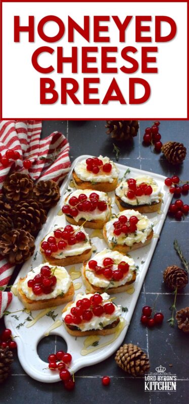 Toast or grill thinly sliced bread and top it with whipped goat cheese. Drizzle over your favourite honey and garnish with fresh thyme leaves and berries. Honeyed Cheese Bread is sweet and salty and is completely irresistible. The creaminess of the cheese and honey is a great match for the chewiness of the toasted baguette. #honey #bread #appetizer #christmas #holiday