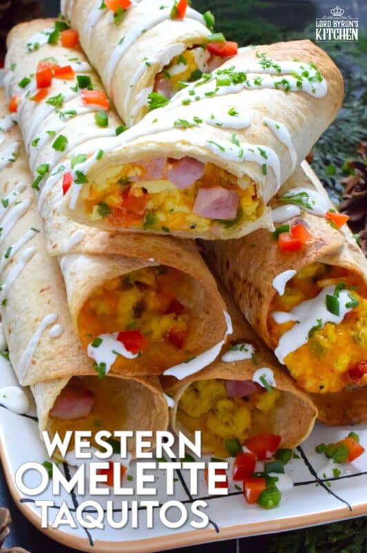 Eggs, bell peppers, onions, shredded cheese, and chopped cooked ham are the ingredients that make up the popular Western Omelette breakfast.  For these taquitos, the omelette was fully prepared, rolled in a flour tortilla and baked until golden brown.  These make a delicious breakfast that can easily be prepared in advance and frozen. #western #omelette #taquitos #breakfast
