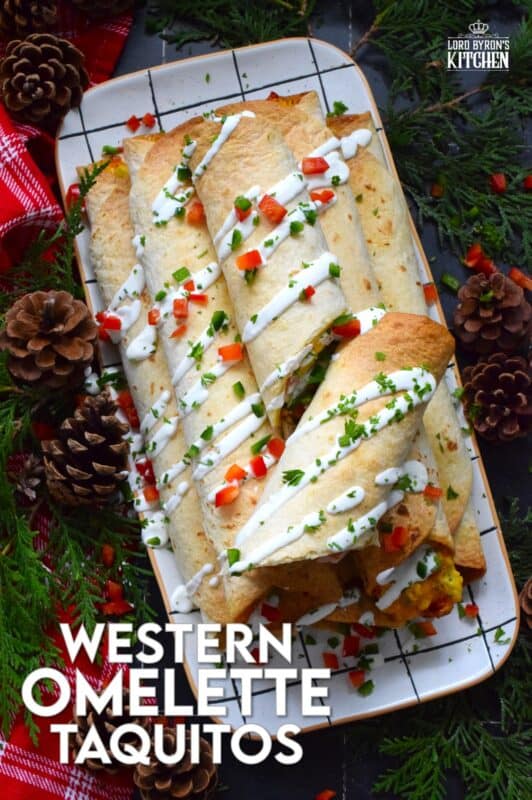 Eggs, bell peppers, onions, shredded cheese, and chopped cooked ham are the ingredients that make up the popular Western Omelette breakfast.  For these taquitos, the omelette was fully prepared, rolled in a flour tortilla and baked until golden brown.  These make a delicious breakfast that can easily be prepared in advance and frozen. #western #omelette #taquitos #breakfast