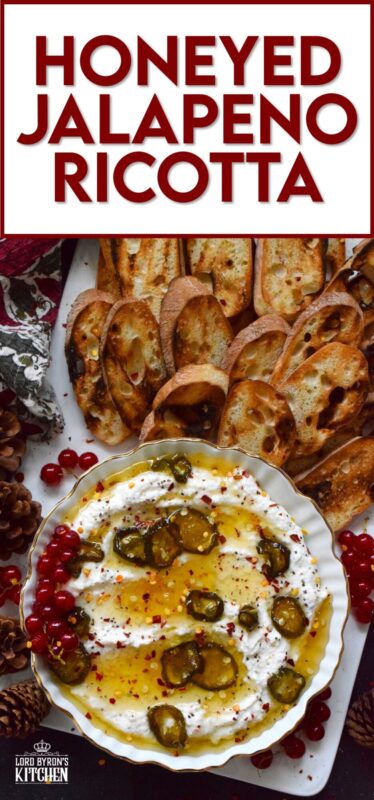 When you whip ricotta with garlic, onion, oregano, and sour cream, not only is the flavour incredible, but the texture is silky smooth. Topped with homemade Jalapeno Honey, this dip is cool and spicy at the same time. Serve with your favourite crackers and bread. #ricotta #appetizer #spread #dip #cheese #honey #jalapeno
