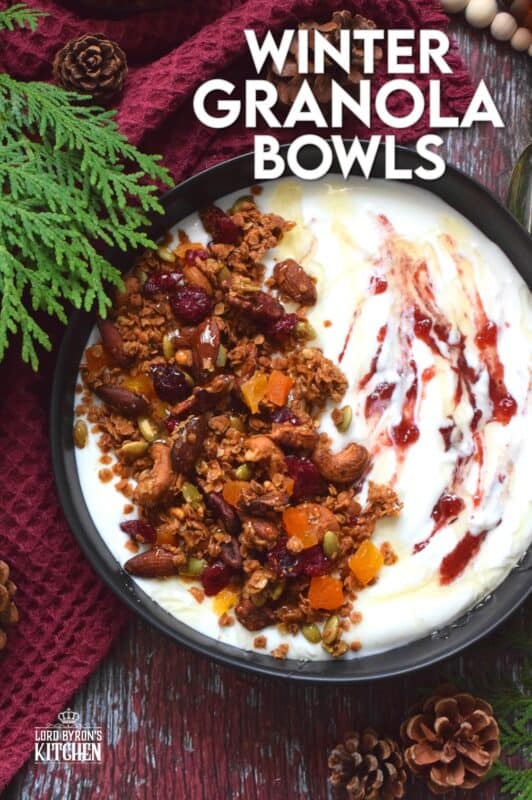 Almonds, cashews, pecans, pumpkin seeds, cranberries, and apricots help to flavour and bulk up homemade granola. Baked with maple syrup and butter, and seasoned with cinnamon, nutmeg, and allspice, these Winter Granola Bowls are healthy, warming, and filling too! #granola #breakfast #bowls #spiced
