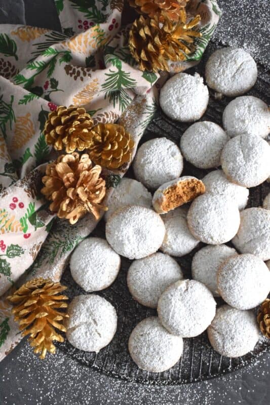 Spiced Holiday Biscuits have a soft, chewy, and moist center with a sweet, crunchy crust. Loaded with familiar holiday spices like cinnamon, nutmeg, cloves, ginger, and allspice, these treats pack a flavour punch unlike any other Christmas confection! The excess dusting of sugar adds just the right amount of sweetness to balance out the warm heat of the cookie.