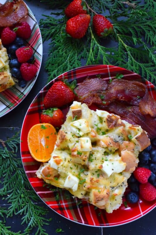 A casserole is one of the easiest ways to serve a filling and hearty breakfast on Christmas morning. Prepared with eggs, bagels, bacon, and cheese, and refrigerated overnight, presenting a delicious breakfast on an exciting and busy morning couldn't be easier! #casserole #breakfast #holiday #makeahead