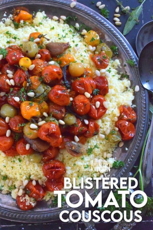 Summer fresh cherry tomatoes are slowly roasted with garlic, onions, and herbs in olive oil until the skins have blistered. Spoon over cooked couscous and sprinkle with pinenuts for a delicous, comforting, and filling main or side! #couscous #confit #tomato #roasted