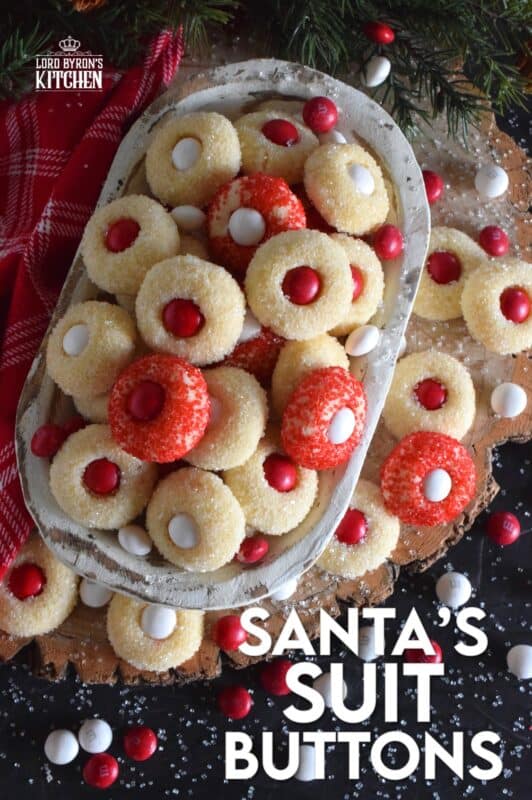These are miniature, one-bite cookies that are made with Christmas M&M candy centers. Santa's Suit Buttons are a wonderful gift idea, a great baking project with the kids, or bake them alone and save them all for yourself! #santassuit #buttons #cookies #christmas #holiday #baking #kids