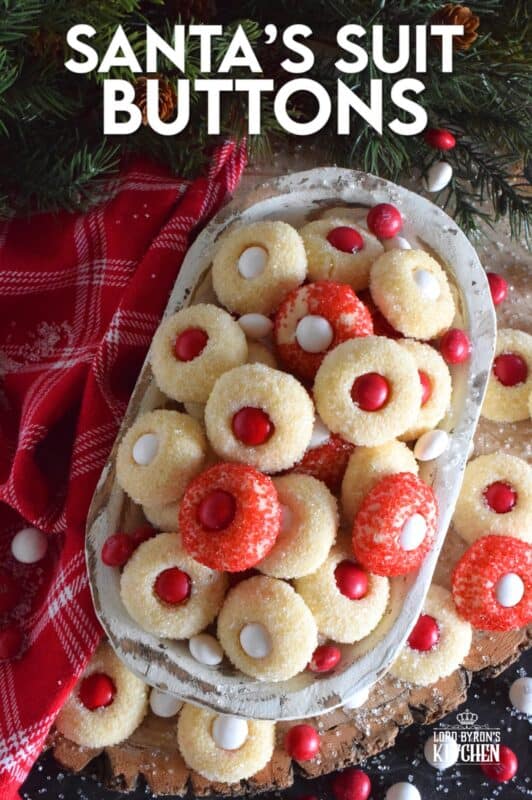 These are miniature, one-bite cookies that are made with Christmas M&M candy centers. Santa's Suit Buttons are a wonderful gift idea, a great baking project with the kids, or bake them alone and save them all for yourself! #santassuit #buttons #cookies #christmas #holiday #baking #kids