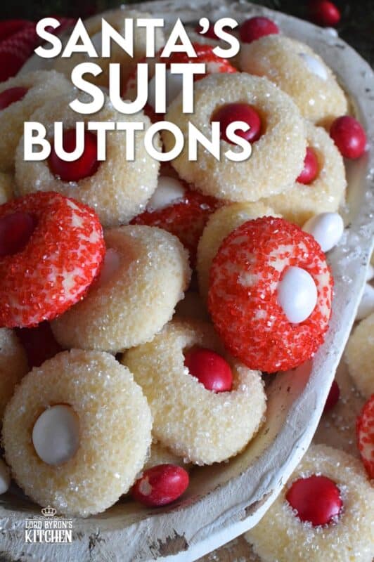 These are miniature, one-bite cookies that are made with Christmas M&M candy centers. Santa's Suit Buttons are a wonderful gift idea, a great baking project with the kids, or bake them alone and save them all for yourself! #santassuit #buttons #cookies #christmas #holiday #baking #kids