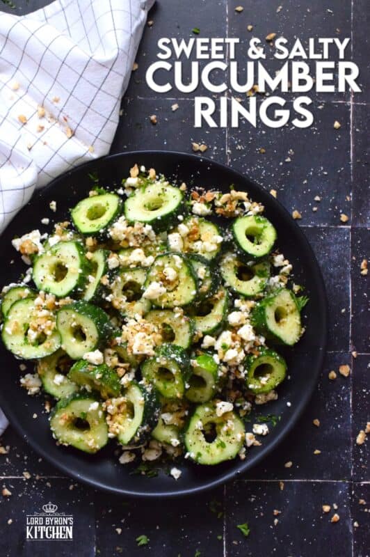 A great side or a refreshing snack, Sweet and Salty Cucumber Rings are the result of summer fresh cucumbers being paired with toasted pecans, crumbled feta, and lots of drizzled honey. Serve at room temperature immediately after preparing for the best results! #cucumber #sweetandsalty #salad #snack #feta