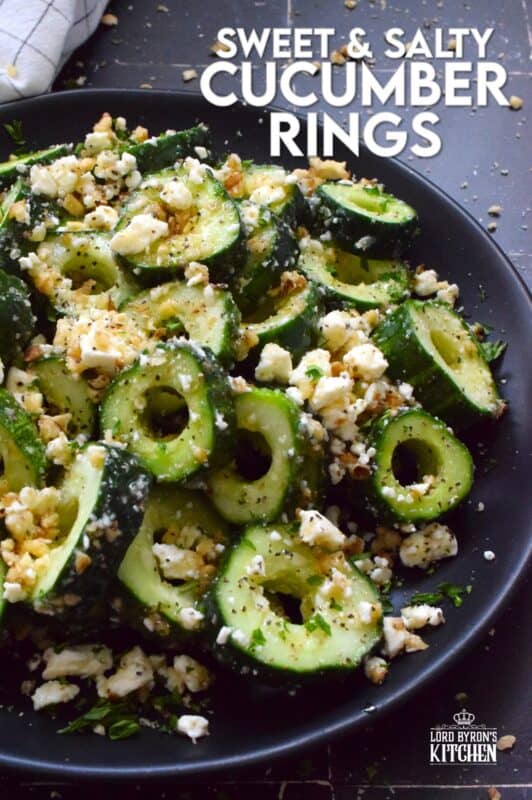 A great side or a refreshing snack, Sweet and Salty Cucumber Rings are the result of summer fresh cucumbers being paired with toasted pecans, crumbled feta, and lots of drizzled honey. Serve at room temperature immediately after preparing for the best results! #cucumber #sweetandsalty #salad #snack #feta
