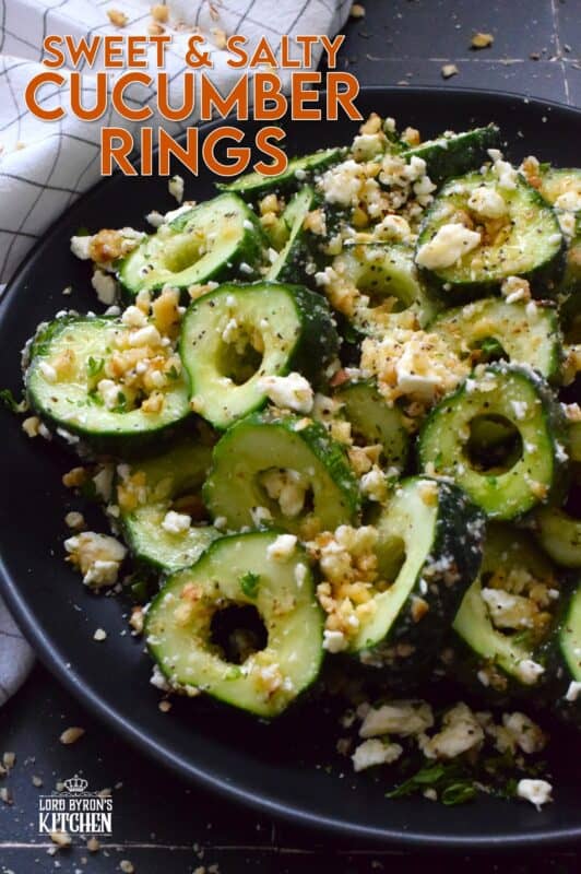 A great side or a refreshing snack, Sweet and Salty Cucumber Rings are the result of summer fresh cucumbers being paired with toasted pecans, crumbled feta, and lots of drizzled honey. Serve at room temperature immediately after preparing for the best results! #cucumber #sweetandsalty #salad #snack #feta