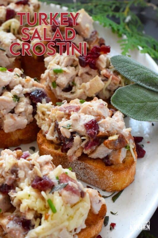 Chopped turkey breast meat is combined with bacon, cheese, and cranberries and piled onto lightly toasted or grilled bread. These crostini are savoury and sweet and have the makings of a great Christmas dinner in appetizer form. Alternatively, serve the turkey salad with crackers as a dip! #turkey #cranberry #crostini #appetizer #bacon