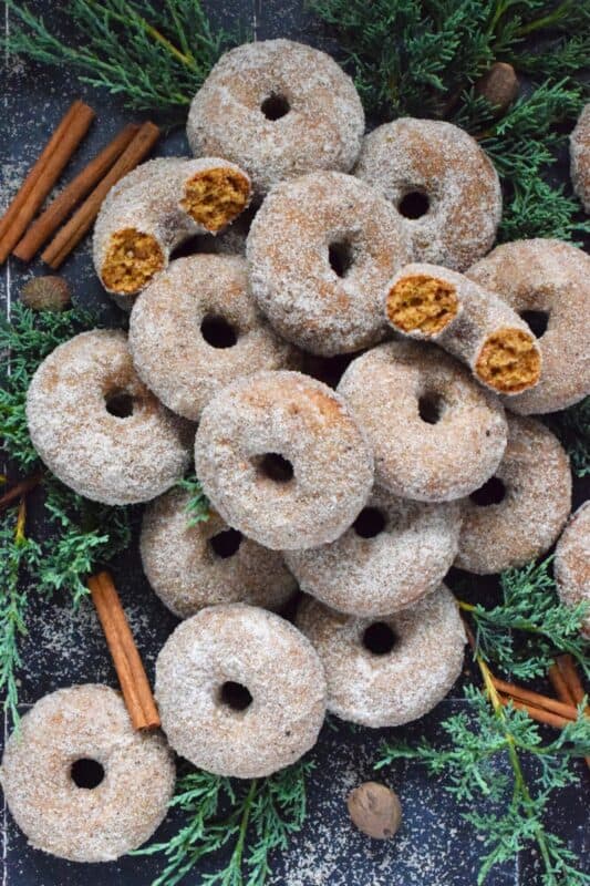 Prepared with everyone's favourite seasoning spices, like cinnamon, nutmeg, ginger, cloves, and allspice, these Sugared Gingerbread Donuts are baked and rolled in sugar while still warm out of the oven. Indulgent, sweet, rich, and delicious, these donuts taste like Christmas! #gingerbread #donuts #bakednotfried