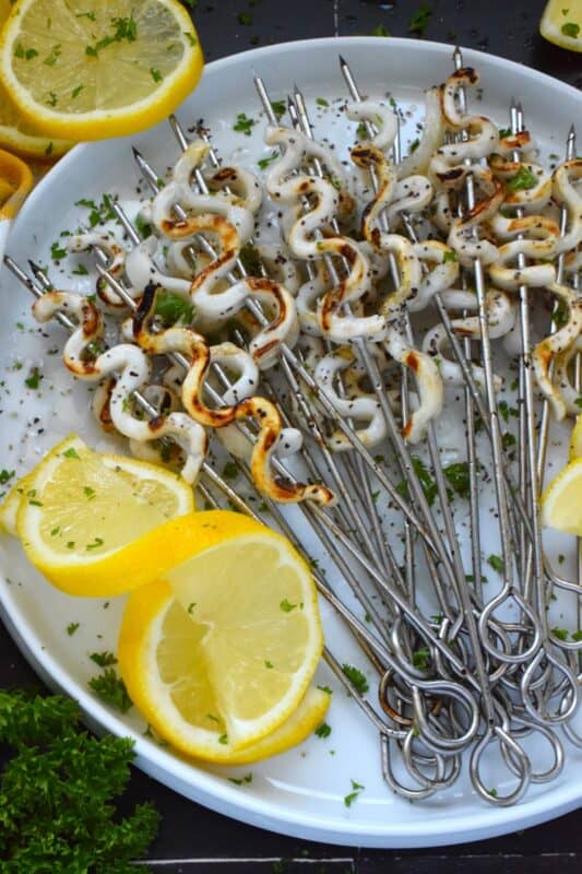 Sometimes, a simple recipe, one that leaves the main ingredient in a near-pure form, is the best! Lemon Pepper Squid is such a recipe; with the help of a few seasonings, some lemon juice, and oil, these are quickly cooked until just charred on a very hot grill so that they are super tender and most certainly super flavourful! #lemonpepper #squid #grilled #seafood