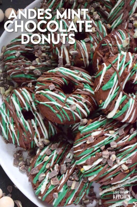 These donuts are loaded with mint flavour and are meant for serious mint and chocolate lovers. Andes Mint Chocolate Donuts are baked with good cocoa, mint extract, and mint chocolate, and topped with green candy melts and melted white and milk chocolate. It was so hard to eat just one of these! #andesmints #chocolates #donuts