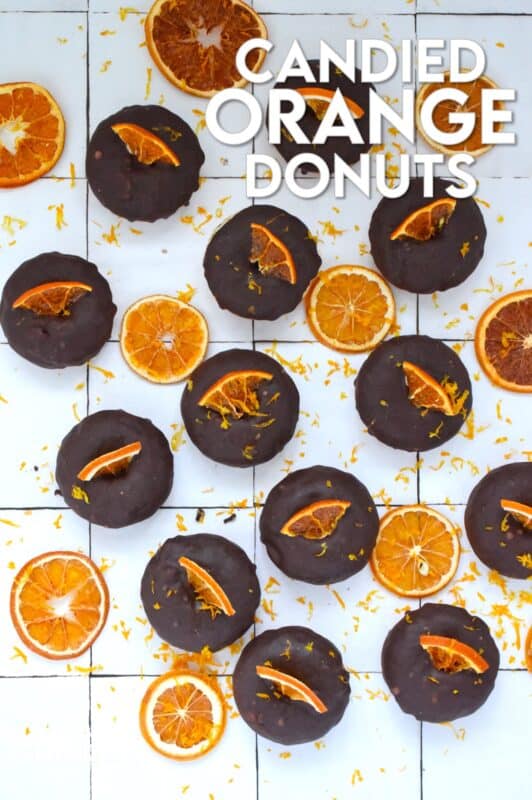 The combination of chocolate and orange is often found in holiday baking, and oranges have quite a history when it comes to being a staple in most Christmas traditions. Candied Orange Donuts is the dessert you didn't know you needed this Christmas! #candied #orange #donut #doughnut