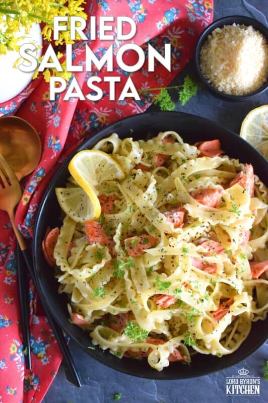 Salmon fillets are lightly seasoned and fried in butter until they are perfectly done. The salmon is gently flaked into bite-sized pieces and tossed with cooked pasta, lemon juice and zest, and lots of garlic. Fried Salmon Pasta is a beautiful and delicious main which takes less than 30 minutes from start to finish! #salmon #pasta #seafood #spaghetti #lemongarlic