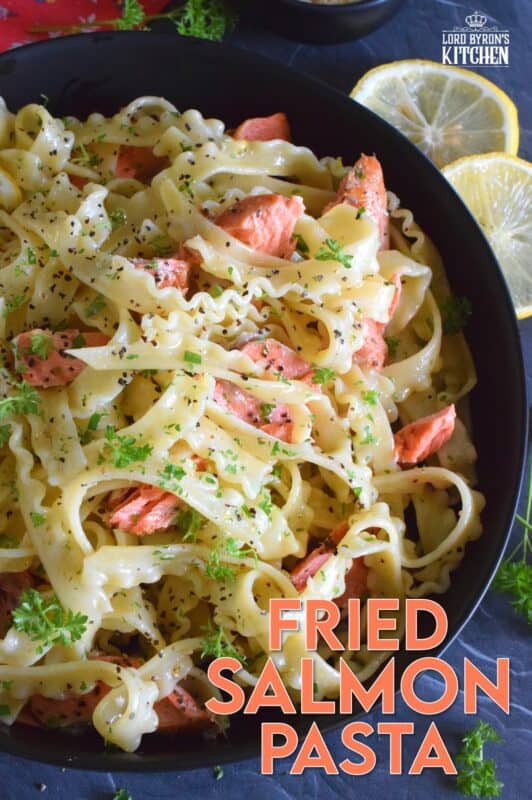 Salmon fillets are lightly seasoned and fried in butter until they are perfectly done. The salmon is gently flaked into bite-sized pieces and tossed with cooked pasta, lemon juice and zest, and lots of garlic. Fried Salmon Pasta is a beautiful and delicious main which takes less than 30 minutes from start to finish! #salmon #pasta #seafood #spaghetti #lemongarlic