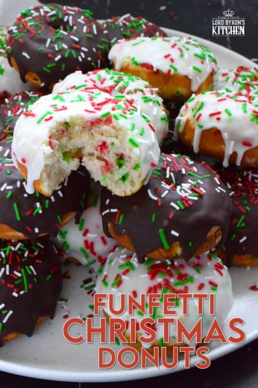 For the kid in all of us this holiday season let's make some Funfetti Christmas Donuts! This light and fluffy vanilla donut is filled with sprinkles and topped with a sugary, sweet glaze. Better than store-bought, these donuts make a lovely bring-along party treat as well! #funfetti #sprinkles #christmas #donuts #doughnuts
