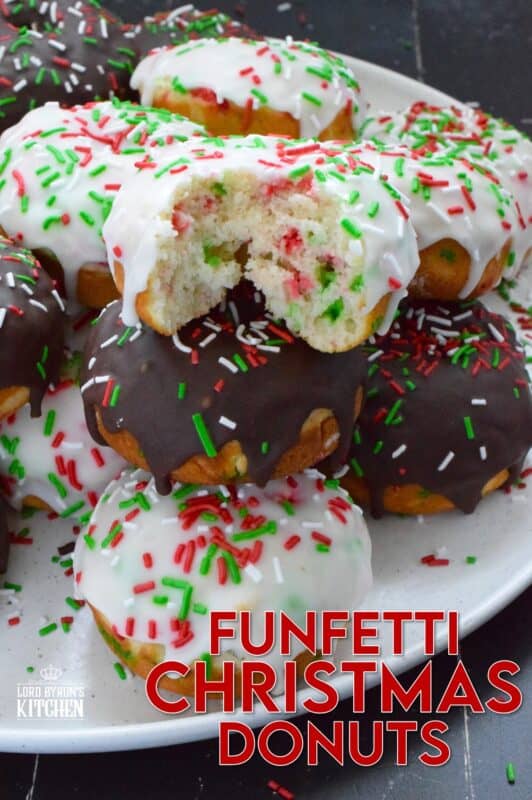For the kid in all of us this holiday season let's make some Funfetti Christmas Donuts! This light and fluffy vanilla donut is filled with sprinkles and topped with a sugary, sweet glaze. Better than store-bought, these donuts make a lovely bring-along party treat as well! #funfetti #sprinkles #christmas #donuts #doughnuts
