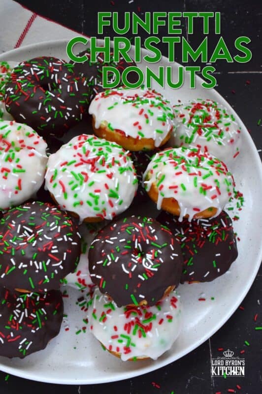 For the kid in all of us this holiday season let's make some Funfetti Christmas Donuts! This light and fluffy vanilla donut is filled with sprinkles and topped with a sugary, sweet glaze. Better than store-bought, these donuts make a lovely bring-along party treat as well! #funfetti #sprinkles #christmas #donuts #doughnuts