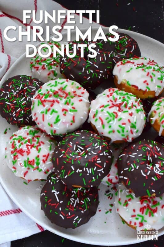 For the kid in all of us this holiday season let's make some Funfetti Christmas Donuts! This light and fluffy vanilla donut is filled with sprinkles and topped with a sugary, sweet glaze. Better than store-bought, these donuts make a lovely bring-along party treat as well! #funfetti #sprinkles #christmas #donuts #doughnuts