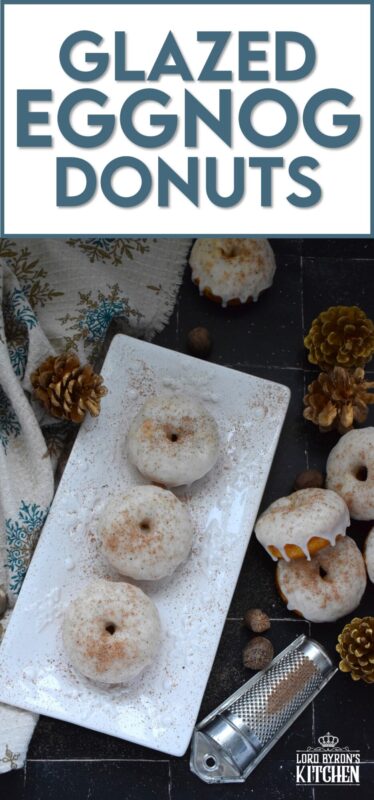 These Glazed Eggnog Donuts are baked and not fried, which means they are super light and fluffy. Eggnog is baked right into the batter and the glaze is made with eggnog too, ensuring that this donut lives up to its name! Optionally, this recipe permits a splash or rum or an alcohol-free version too! #donuts #doughnuts #eggnog #christmas #baked