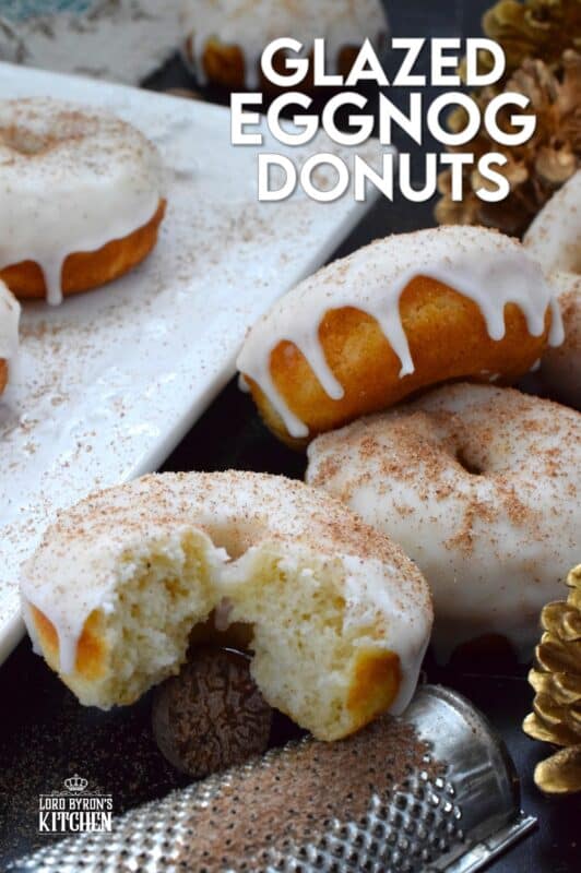 These Glazed Eggnog Donuts are baked and not fried, which means they are super light and fluffy. Eggnog is baked right into the batter and the glaze is made with eggnog too, ensuring that this donut lives up to its name! Optionally, this recipe permits a splash or rum or an alcohol-free version too! #donuts #doughnuts #eggnog #christmas #baked