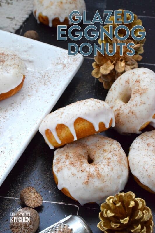 These Glazed Eggnog Donuts are baked and not fried, which means they are super light and fluffy. Eggnog is baked right into the batter and the glaze is made with eggnog too, ensuring that this donut lives up to its name! Optionally, this recipe permits a splash or rum or an alcohol-free version too! #donuts #doughnuts #eggnog #christmas #baked