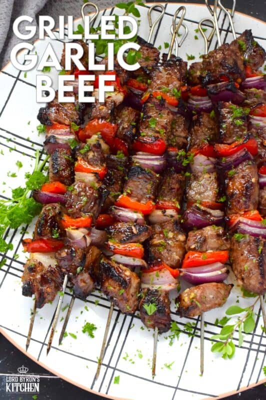 Marinated and skewered, Grilled Garlic Beef is simple and easy to prepare, but the flavour is extraordinary! The quick-to-prepare marinade is loaded with garlic which both permeates the beef and tenderizes it too. The addition of the onions and sweet bell peppers round out the flavour. #beef #garlic #garlicky #grill #bbq