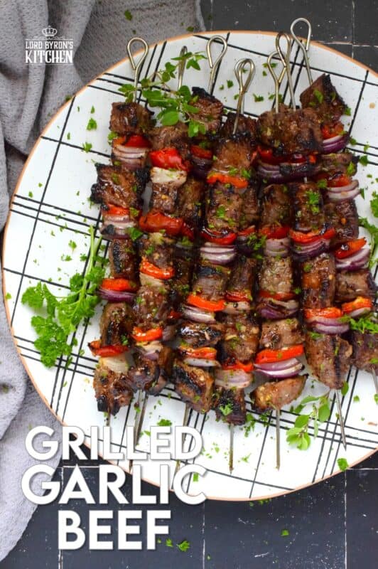 Marinated and skewered, Grilled Garlic Beef is simple and easy to prepare, but the flavour is extraordinary! The quick-to-prepare marinade is loaded with garlic which both permeates the beef and tenderizes it too. The addition of the onions and sweet bell peppers round out the flavour. #beef #garlic #garlicky #grill #bbq