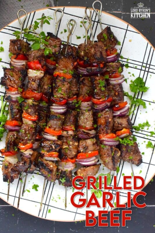 Marinated and skewered, Grilled Garlic Beef is simple and easy to prepare, but the flavour is extraordinary! The quick-to-prepare marinade is loaded with garlic which both permeates the beef and tenderizes it too. The addition of the onions and sweet bell peppers round out the flavour. #beef #garlic #garlicky #grill #bbq