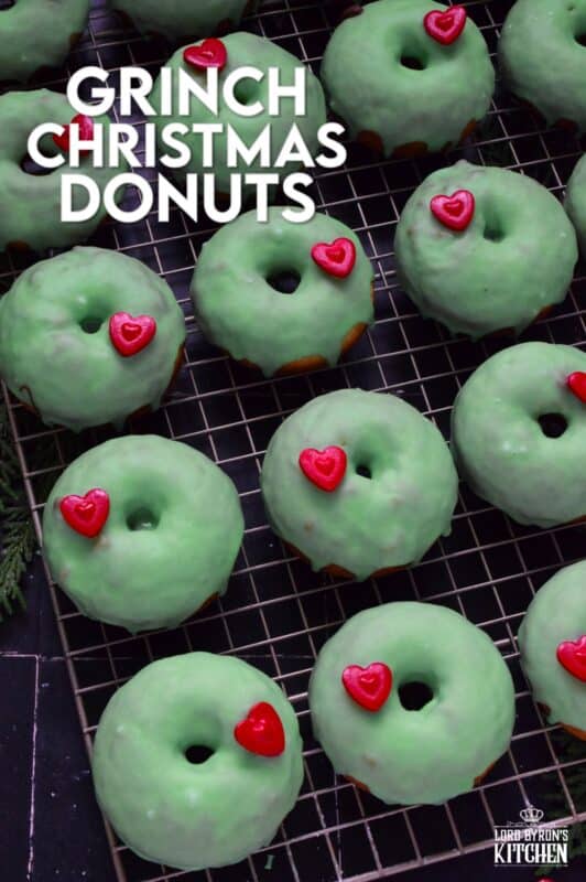 Grinch-themed confections are very popular at Christmastime, especially with kids! But even the adults will love these Grinch Christmas Donuts! Prepared with a baked basic donut recipe, these are dipped in green icing and despite the fact that the Grinch’s heart was three sizes too small, I’ve used the biggest red candy heart I could find! #ginch #donuts
