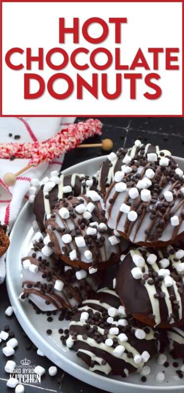 Good cocoa is the secret to a decadent hot chocolate; the same can be said for these Hot Chocolate Donuts.  Marshmallows are baked into the chocolate donut and sprinkled on top of the white glaze and the chocolate drizzle.  These baked donuts are for the ultimate chocolate lover! #hotchocolate #donuts #marshmallows