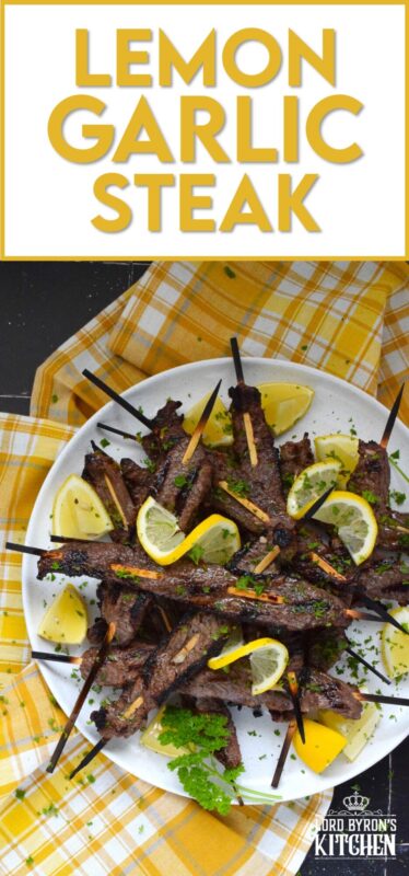 Thin slices of beef are marinated with fresh lemon juice, chopped garlic, and seasonings before being skewered and grilled to perfection!  Be sure to serve this Lemon Garlic Steak with lots of fresh lemons for extra zip and zing! #steak #grilled #garlic #lemon
