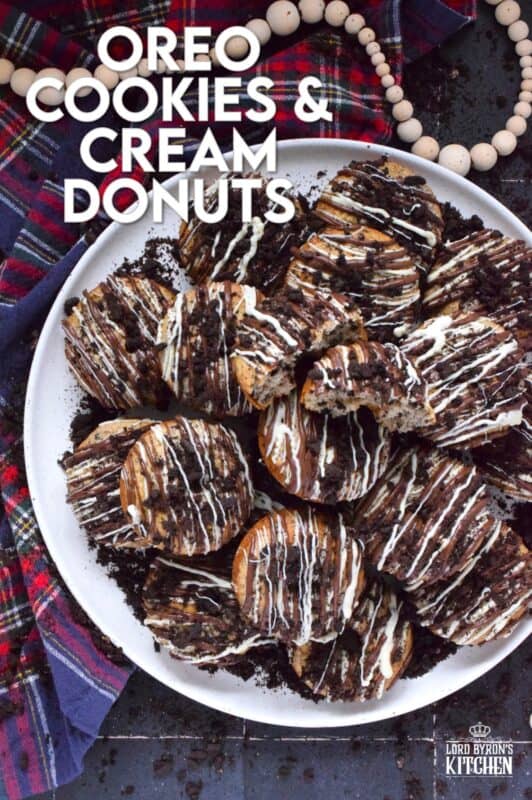 Crushed Oreo cookies are packed into the most delicious vanilla cake donuts and topped with smooth, melted white and milk chocolate, and even more crushed Oreos! Don't worry about the indulgence of these donuts because they're baked and not fried which means you're saving on calories! Right!? #cookiesandcream #oreo #donuts