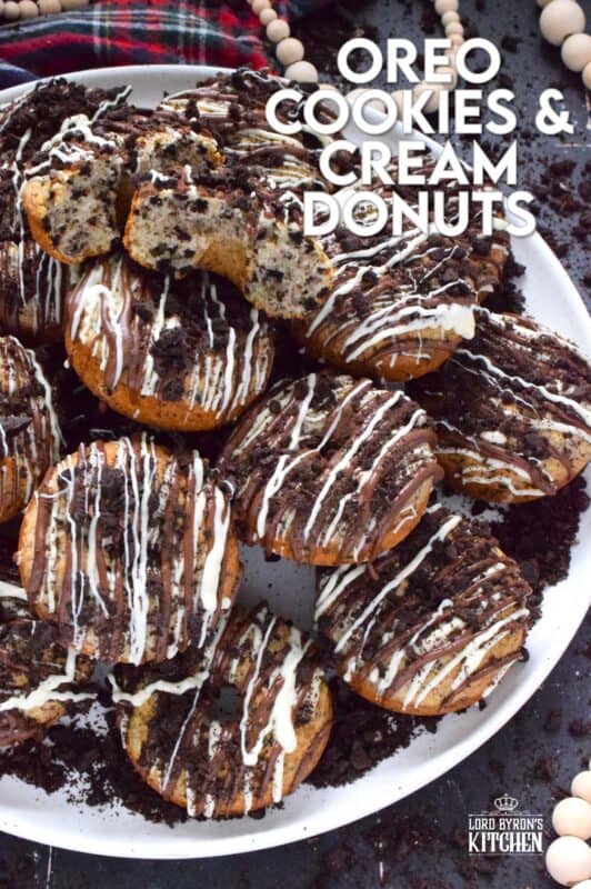 Crushed Oreo cookies are packed into the most delicious vanilla cake donuts and topped with smooth, melted white and milk chocolate, and even more crushed Oreos! Don't worry about the indulgence of these donuts because they're baked and not fried which means you're saving on calories! Right!? #cookiesandcream #oreo #donuts