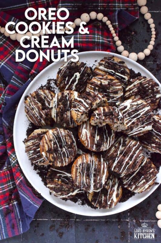 Crushed Oreo cookies are packed into the most delicious vanilla cake donuts and topped with smooth, melted white and milk chocolate, and even more crushed Oreos! Don't worry about the indulgence of these donuts because they're baked and not fried which means you're saving on calories! Right!? #cookiesandcream #oreo #donuts