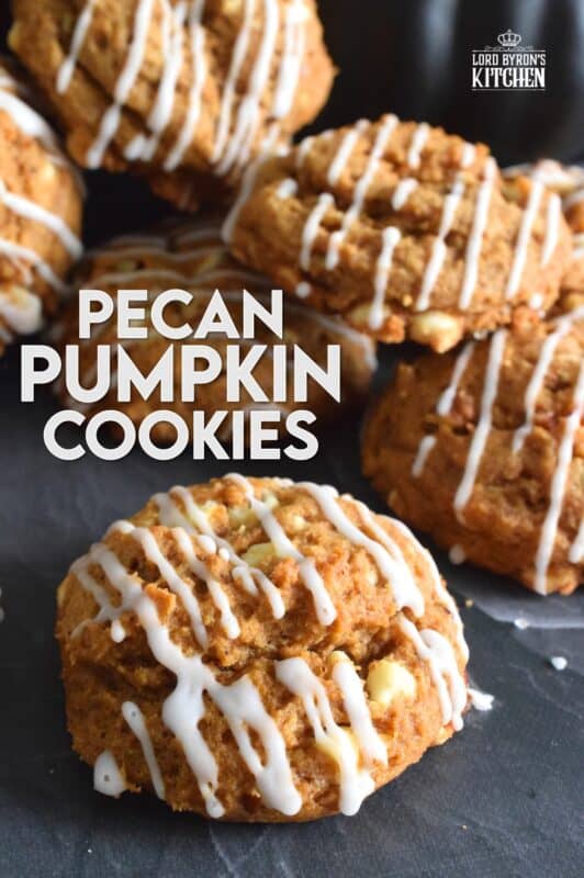 Pecan Pumpkin Cookies are prepared with molasses, real pumpkin puree, lots of pumpkin spice flavour, white chocolate chips, and chopped pecans. Topped with a sweet glaze, they are delectably moist and flavourful. If you're looking for a cookie that tastes like fall, look no further! #pumpkin #pecan #spice #puree #cookies